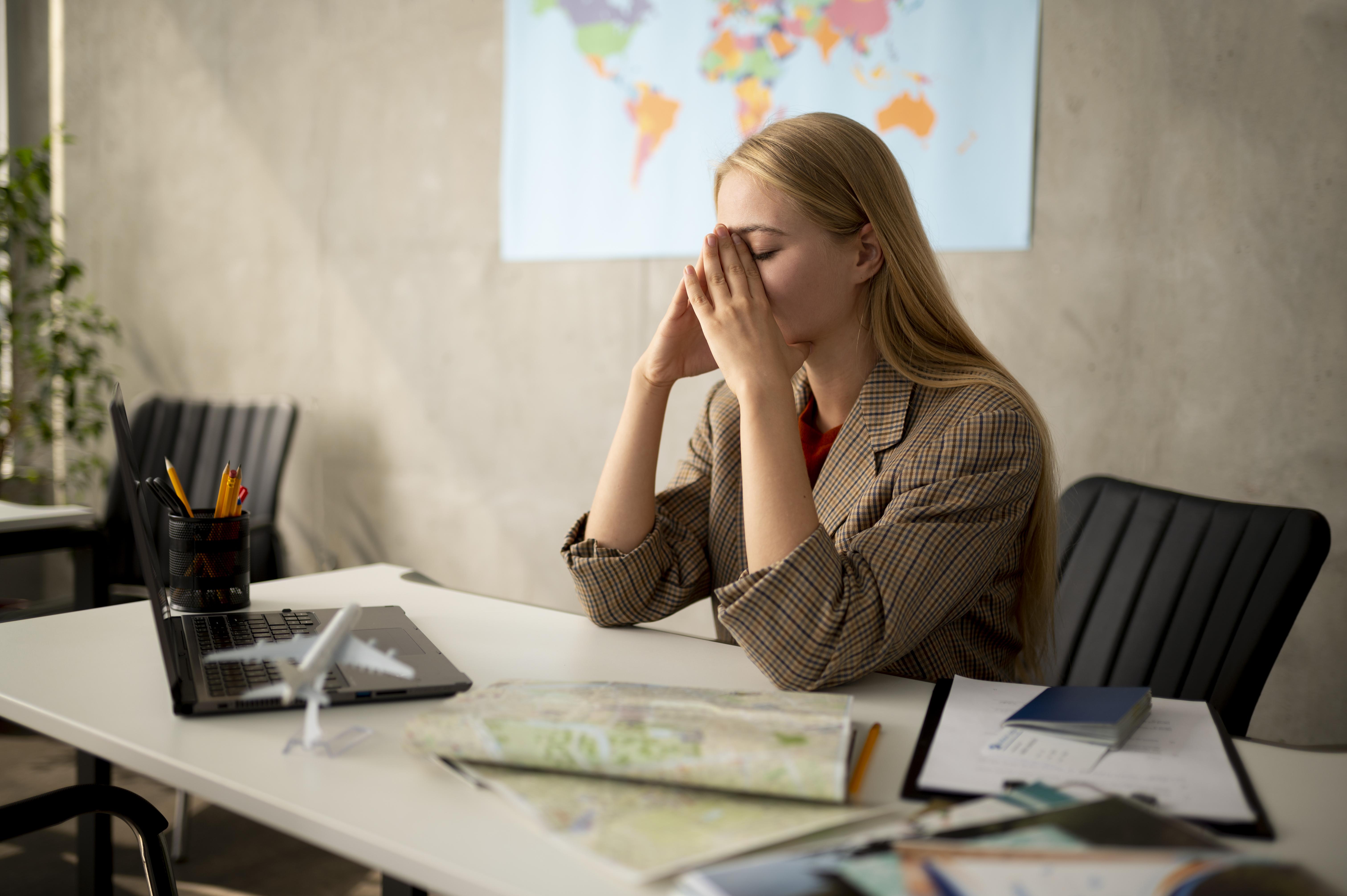 medium shot sad woman travel agency