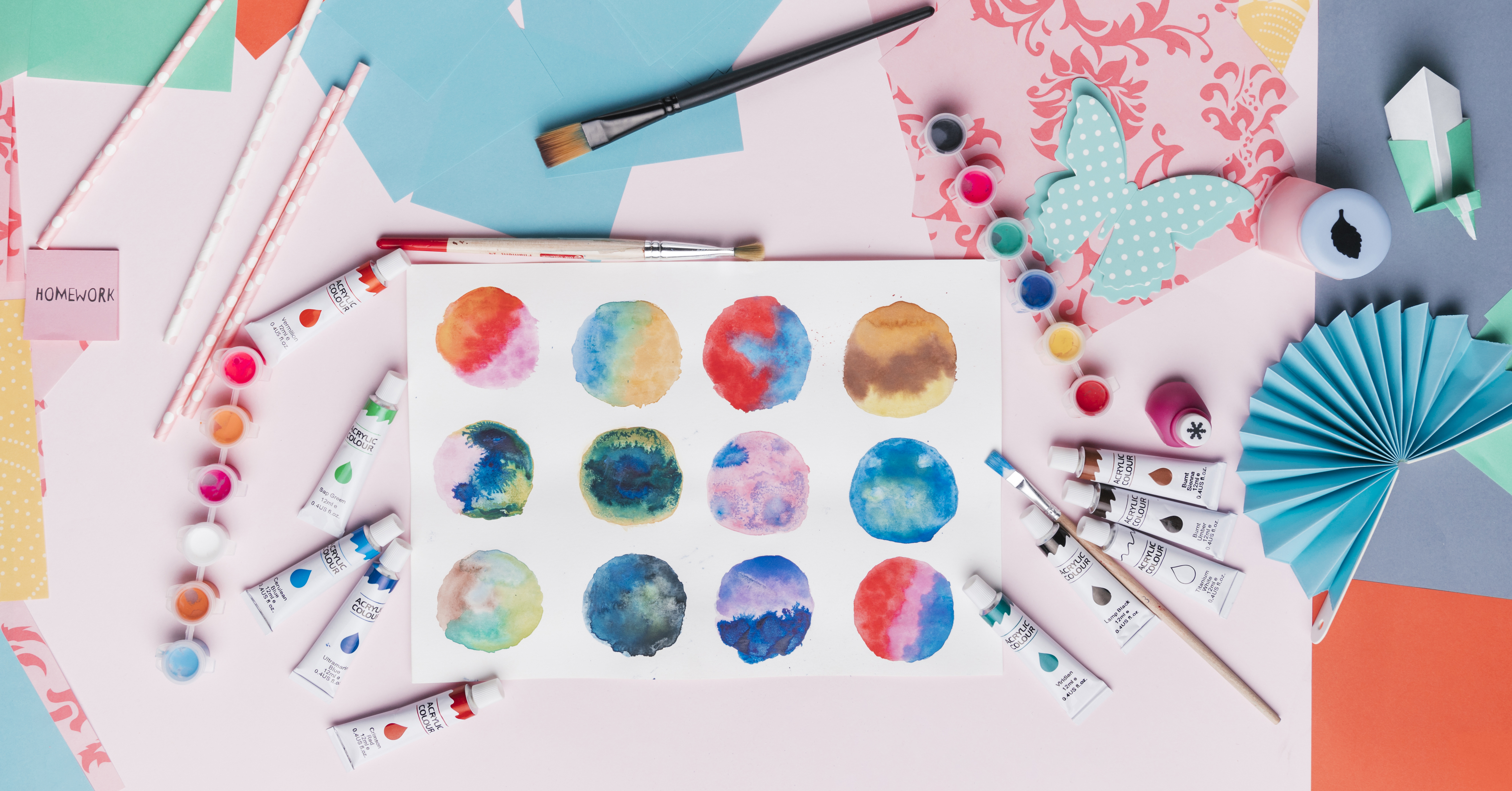 elevated view colorful abstract circle painting straw origami painting